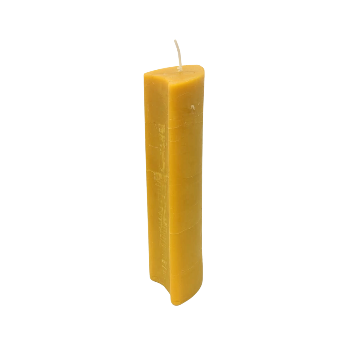 Compact, smooth candle with shield-shaped cross-section